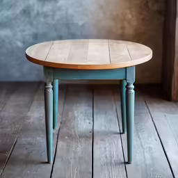 wooden table with oval shaped legs sits on a wooden floor