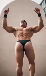 a male with no shirt is flexing his muscles