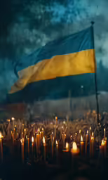 many candles in front of the flag and a sky background