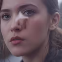 the woman is staring in anticipation of seeing something