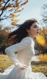 woman wearing white dress and flying hair in open area
