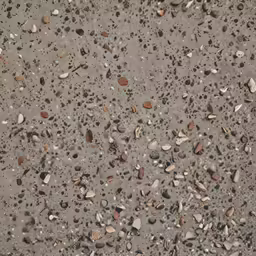 an old concrete ground with tiny rocks and gravel