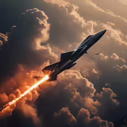 a jet airplane in the sky with clouds below