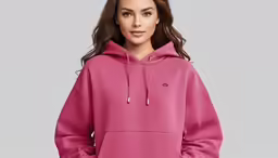 a woman wearing a pink sweatshirt and leggings