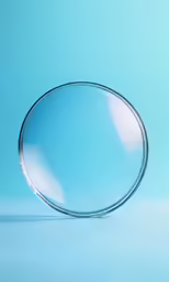 a glass of wine sits on a blue table