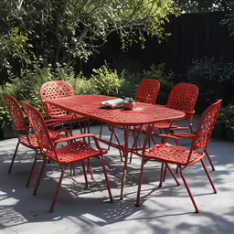 the red patio table and eight chairs are outside