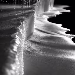 water spewing from the side of a fountain