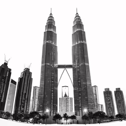a black and white photo of some very tall buildings