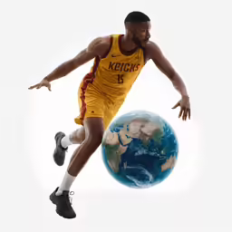 a man in a yellow jersey jumping up and bouncing a ball