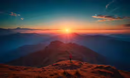 a man standing on top of a mountain