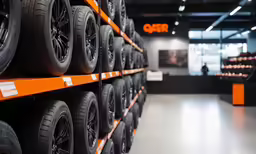 a large rack of tires is shown in this store