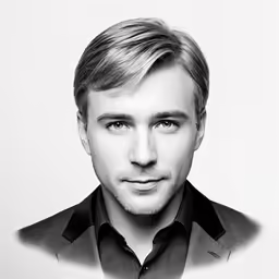 a man with long blonde hair wearing a suit