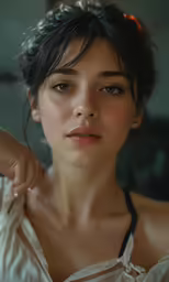 young woman wearing white and posing in a white dress