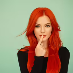 a woman with red hair and wearing a black shirt
