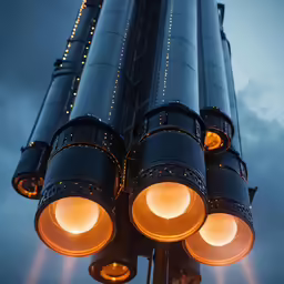 a close - up of two lights on a street light in the evening