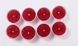 a bunch of grapefruit sliced in half on top of each other