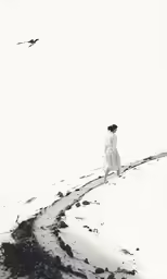 a man is standing alone on a snowy hill