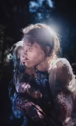 a person holding onto the arms of another woman