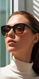 the woman wearing glasses has her hair up