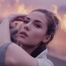 woman in white shirt looking off into distance