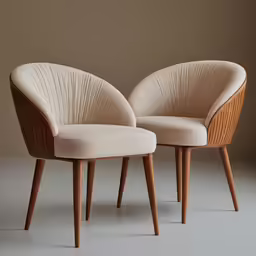 two modern wooden and fabric chairs sit side by side
