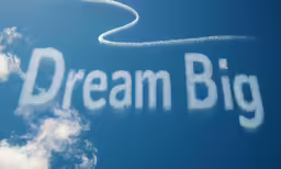 words drawn on a sky to create dream and big