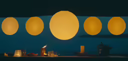 a lit candle sitting on top of a table