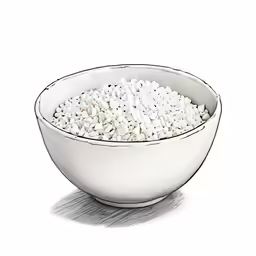a white bowl full of small beans