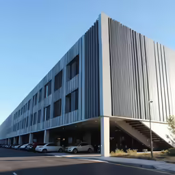 some cars that are parked in front of a building