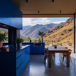 an open kitchen with mountains in the distance