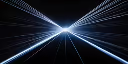 a white tunnel with several lights shining in it