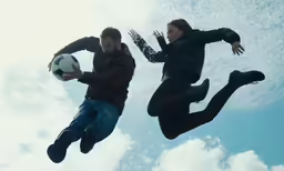 a couple of people are flying through the air