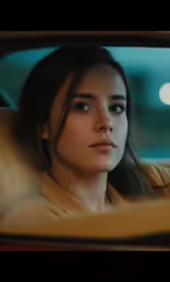 the woman is looking out of her car window
