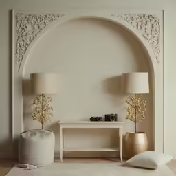 a vase on the floor next to a table and two lamps