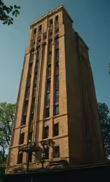 a tall building has windows near one end of the front