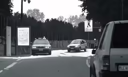a car that is driving down the street