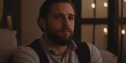 the man is staring off into the distance