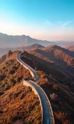 winding roadway between hills on a mountain side