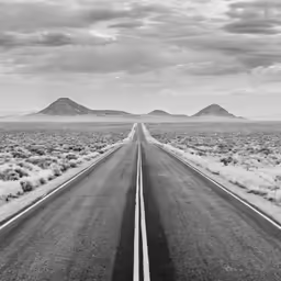 a lone road in the middle of a desert