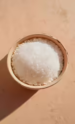 small bowl of white rice sitting on the ground