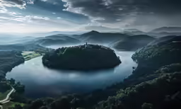 a lake in the middle of a forest surrounded by mountains