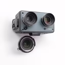 two cameras with their cameras attached to them