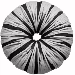 an abstract striped paper sculpture on a white background