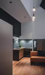 this modern, industrial kitchen is decorated in black and brown