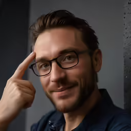 a close up of a person wearing glasses