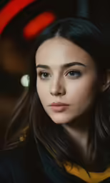 a young woman with a brown collar looks into the camera