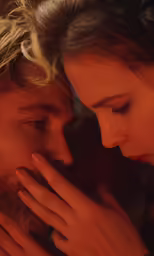a young couple are cuddling together in close - up
