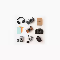 various camera equipment sitting on top of a table