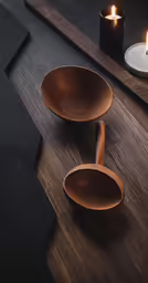 three candles and plates next to one another