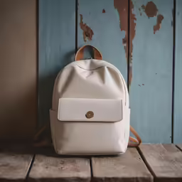 a backpack is sitting on the floor with a wood background